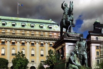 Gustav II Adolf monument on Gustav Adolfs Torg in front of imposing historic buildings, Stockholm,