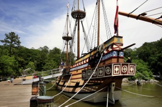 Historic sailing ship Discovery in Jamestown Settlement in front of trees on the water, Jamestown,