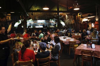 Lively Prejean's restaurant with guests having dinner in a relaxed atmosphere, Lafayette,