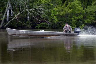 A boat in the wetlands of the Atchafalaya Basin, Atchafalaya Basin, Louisiana, USA