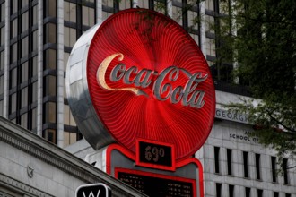 Bright red Coca-Cola advertising sign scores urban in central Atlanta, Atlanta, Georgia, USA
