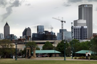 Atlanta skyline with cranes and green landscape, Atlanta, Georgia, USA