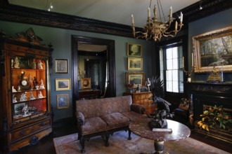 Elegant living room with antique furniture and paintings, zero