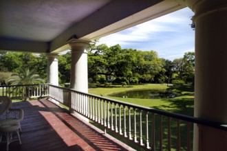 Elegant veranda overlooking a lush garden, zero