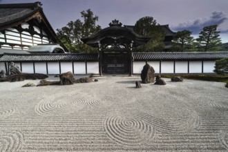 Zen garden with gate and detailed gravel patterns in Tofuku-ji Temple