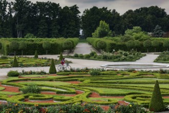 Magnificent baroque garden with symmetrical hedges and green backdrop, Rundale, Latvia