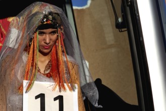 A woman in festive dress at the Miss Election during the Fête des Roses, El Kelâa m'Gouna,