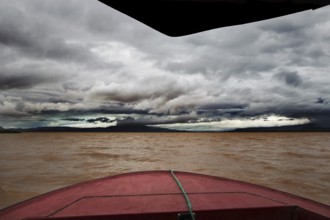 Threatening skies and gloomy waters on a boat trip across Lake Chamo, Nech Sar National Park,