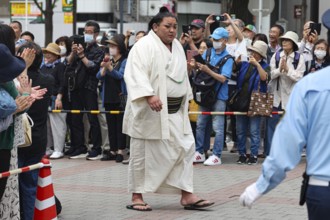 A sumo wrestler in traditional clothing at a public appearance in Tokyo, Tokyo, Ryogoku, Japan
