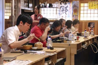 People enjoying meal at traditional restaurant in Ryogoku, Tokyo, Ryogoku, Japan