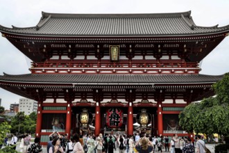 Entrance gate of Senso-ji Temple with crowd, traditional Japanese design, Tokyo, Japan