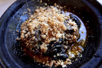 A Moroccan dish with nuts and a juicy texture served in a restaurant, Chefchaouen,