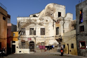 Weathered façade of an old building under a cloudless sky, El Jadida, Cité Portugaise, Morocco