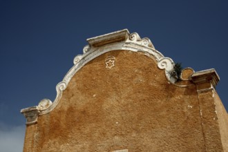 Detailed façade of a historic structure under clear sky, El Jadida, Cité Portugaise, Morocco