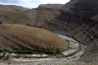 Stratified geological formations in Dadès Canyon with a river, Dadès Gorge, Morocco