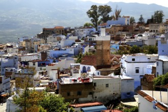 Panoramic view of the iconic blue town of Chefchaouen with surrounding mountains, Chefchaouen,