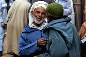 Lively market with traditionally dressed people near Achaouikh, Achaouikh, Morocco