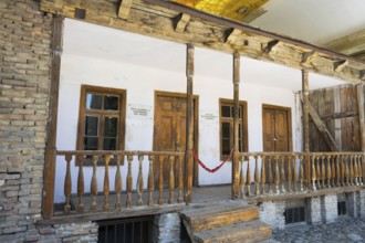 Rustic wooden veranda of a building with old wooden windows, birthplace of Josef Stalin, Gori,