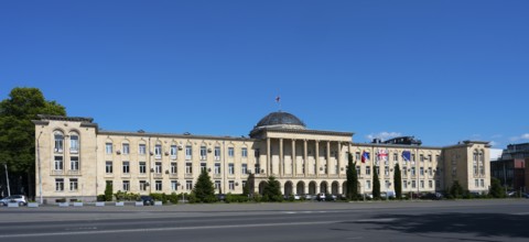 Extensive classical building in panoramic view under bright blue sky, City Hall, Gori, Inner Kartli