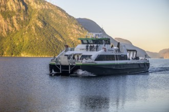 Large ferry operated by the Columbus shipping company sails through the Lysefjord with an