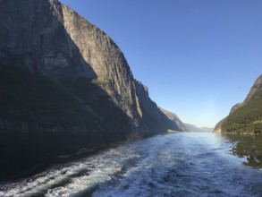 Lysebotn, Rogaland Municipality, Norway, view of the trail of a boat in the quiet Lysefjord between