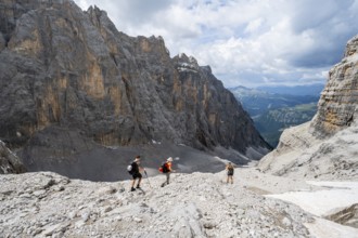 Three climbers descending the Sentiero Martinazzi, Camosci Valley, Brenta Mountains,