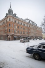 Historic building on the corner of Linnankatu Aurakatu, snowy roads, Turku or Swedish Åbo,