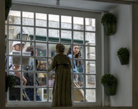 View of passers-by on the street through a cafeteria window, Sintra, Lisbon, Portugal