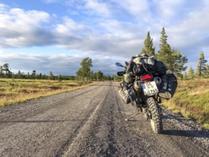 Idre, Dalarnas län, Sweden, BMW G 650 GS Sertao enduro motorcycle on a sunny road in the middle of