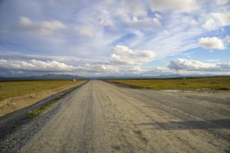 Falkvålen, Bruksvallarna, Jämtland, Sweden, long straight road in a wide landscape under a gently