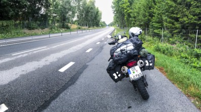 Broby, Skåne län, Sweden, BMW G 650 GS Sertao enduro motorcycle on wet roads with rainy atmosphere