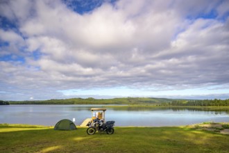 Rörström, Dorotea, Västerbotten, Sweden, picturesque seascape with tent and BMW G 650 GS Sertao