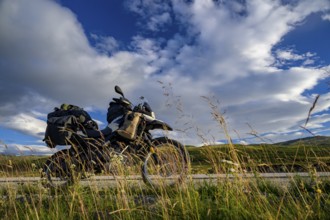 Dalholen, Innlandet, Norway, BMW G 650 GS Sertao enduro motorcycle on a road through an extensive