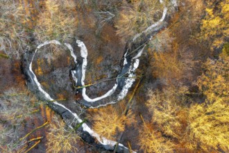 Frozen Määnder river loop of a stream in the Osnbrücker Land seen from the air, Melle, Lower