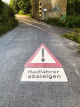 Arnsberg, North Rhine-Westphalia, Germany, road sign warning cyclists to descend, quiet road bend
