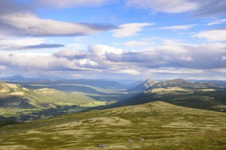 Tylldal, Innlandet, Norway, panoramic view over mountains and valleys with dynamic cloudy skies