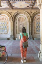 Woman photographs the wall decorations, Bethesda Terrace, Central Park, Manhatten, New York City,