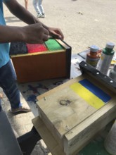 Lower Saxony, Germany, painted bird house in blue and yellow with flowers. Ukrainian students'