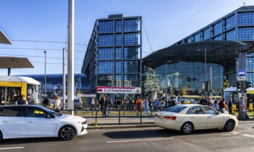 Berlin road traffic with buses, trams and pedestrians at and around the main train station, Berlin,