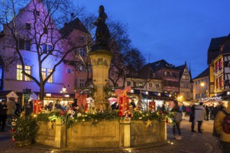 Colourfully illuminated and Christmassy decorated half-timbered houses, old town, blue hour,
