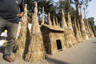 Vendor selling Meji (Bonfite), as part of preparations ahead of the 'Magh Bihu' festival, in
