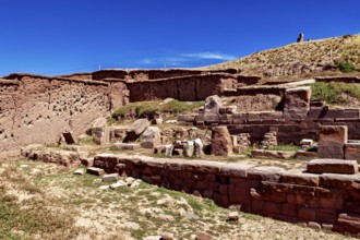 Stone ruins with tiered architecture in a landscape under an open sky, The archaeological site with