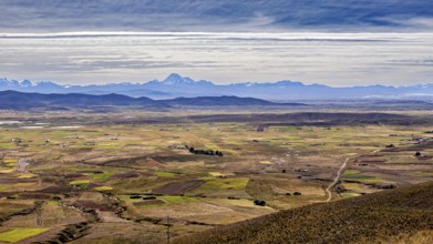 View over a wide plain with mountains in the distance, The Altiplano landscape in the Andes of