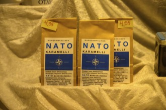 Street scene in the old town of Naantali, NATO caramel packaging boinbons with price tags on golden