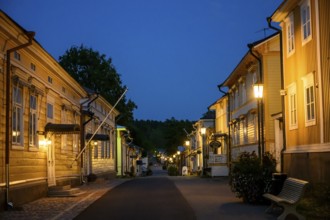 Street scene in the old town of Naantali at night with warmly lit houses, Naanatali,