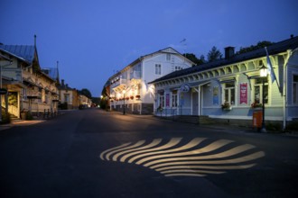 Street scene in the old town of Naantali, A night view of a quiet street with illuminated