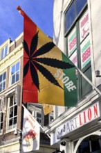 Flag with marijuana leaf at a cannabis shop in the pedestrian zone of The Hague, South Holland
