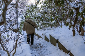 Woman walking down icy stairs, winter, snow, ice, Sieversen, Samtgemeinde Rosengarten, Lower
