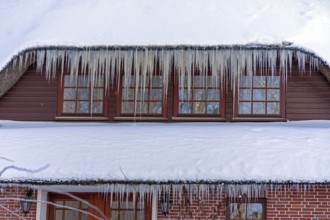 Icicles on a house roof, snow, winter, ice, Sieversen, Samtgemeinde Rosengarten, Lower Saxony,