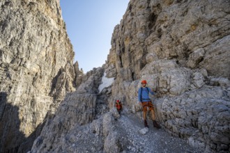 Two mountaineers on the Via Ferrata Bocciere Centrale via ferrata, spectacular mountain landscape